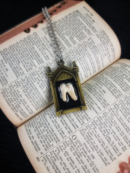 Pulling teeth necklace